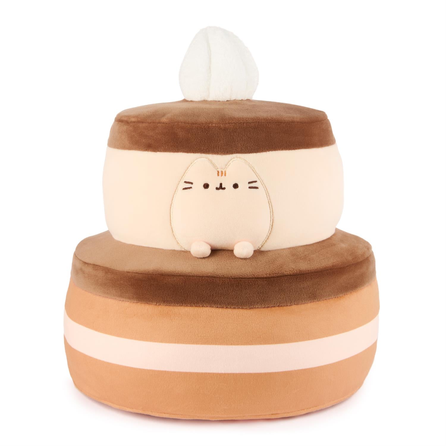 Two-tiered plush dessert toy with Pusheen cat detailing and white topping.