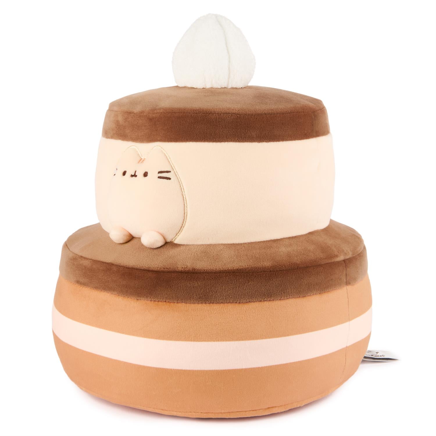 Stuffed two-tiered cake toy with Pusheen face.