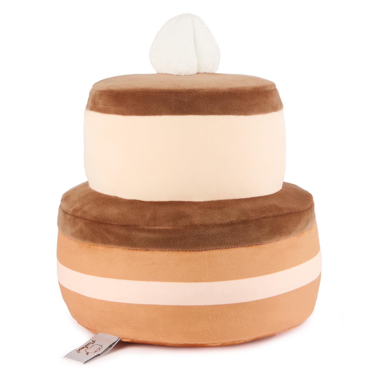 A two-tier cake plush toy with a white frosting top.