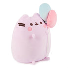 Light purple Pusheen plush holding pink and blue balloons.