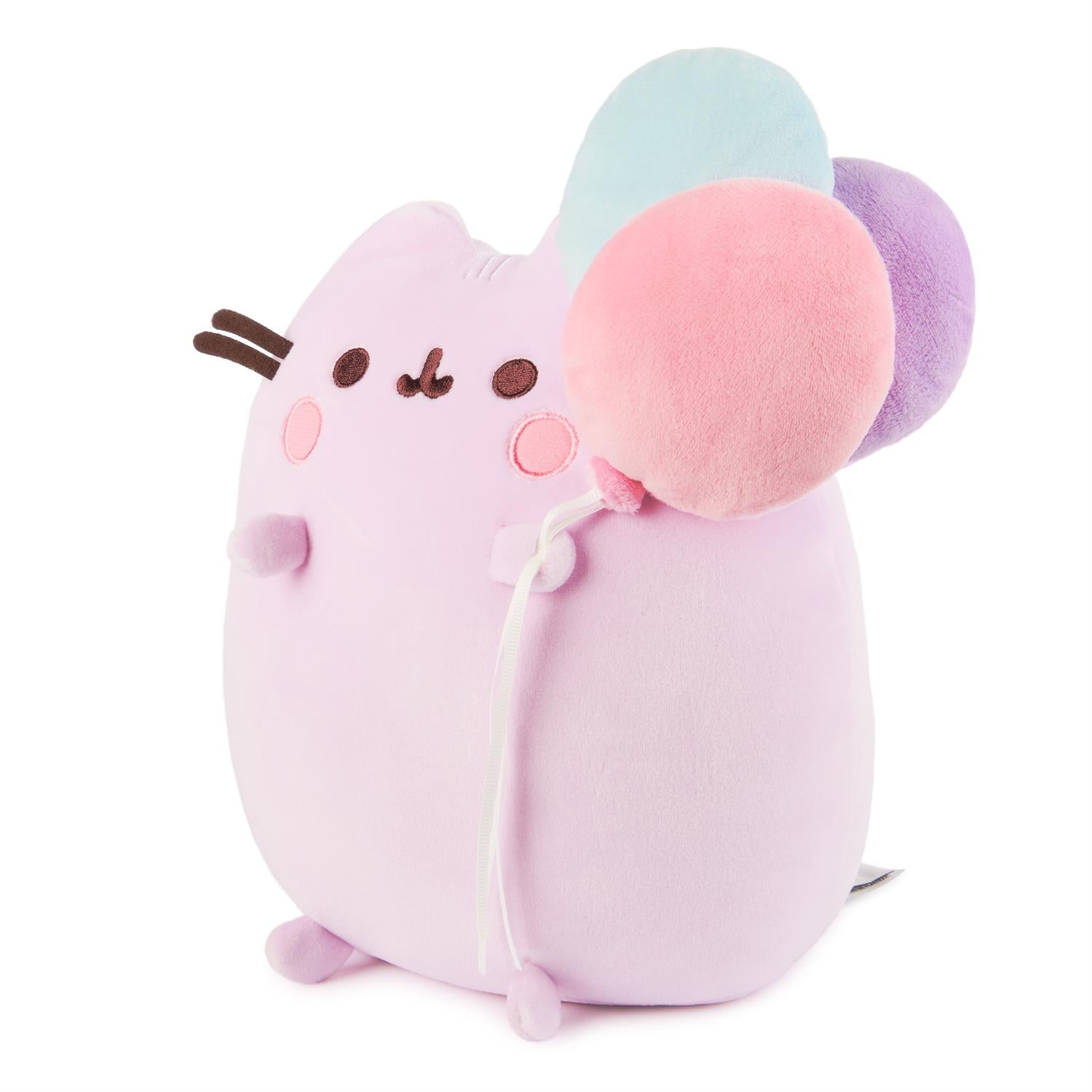 Light-purple plush cat with three colorful balloons.