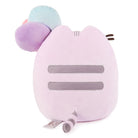 Rear view of a pink Pusheen plush toy with pastel flower headpiece.