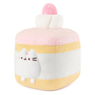 Plush toy shaped like a cake with a cat face.
