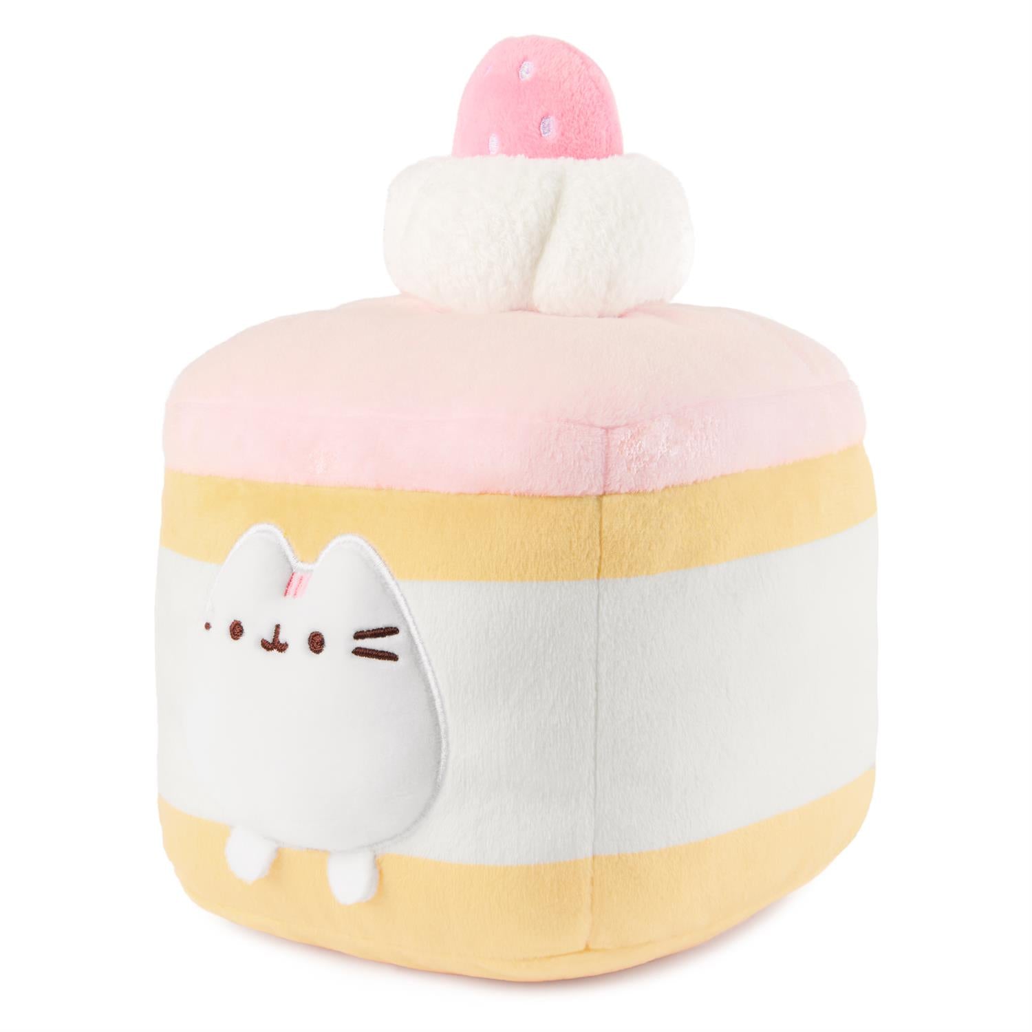 Plush toy shaped like a cake with a cat face.