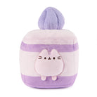 Square, plush, purple and white, striped Pusheen cat with a ball on top.