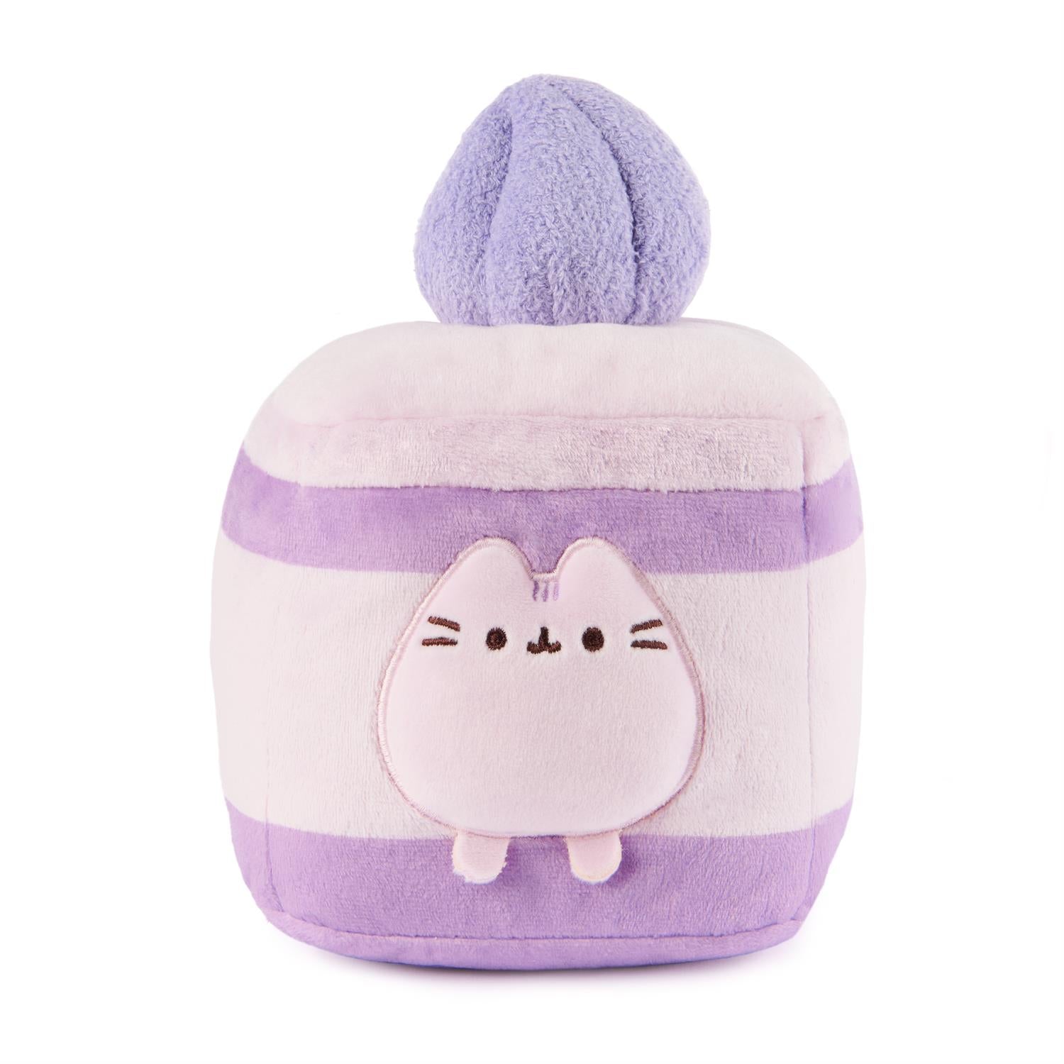 Square, plush, purple and white, striped Pusheen cat with a ball on top.