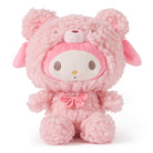 Pink stuffed animal in a bear costume with a pink bow.