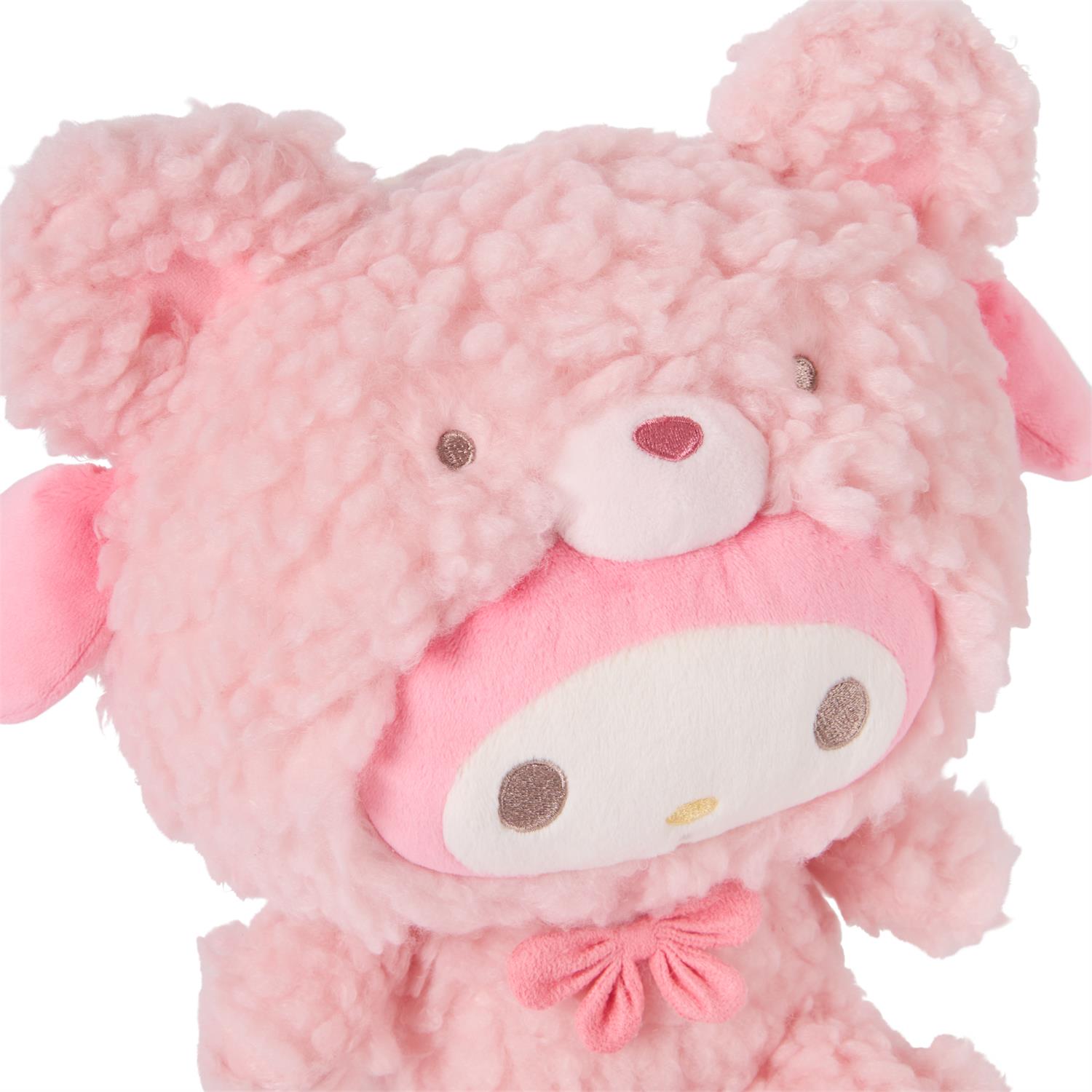 Pink plush My Melody toy with furry ears and a bow.