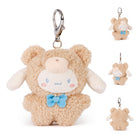 Plush, brown bear keychain with white face and blue bow.