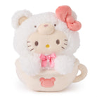 Stuffed Hello Kitty toy in a teacup, wearing a fluffy white bear costume with a pink bow.