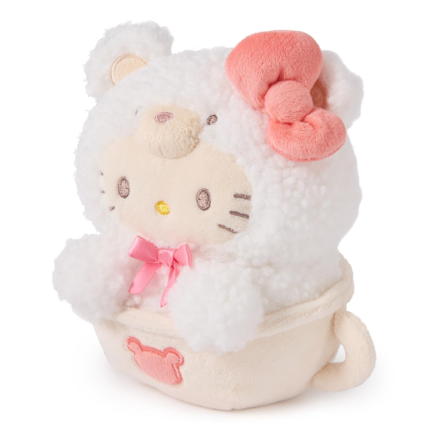 Hello Kitty plush toy dressed as a sheep in a teacup.