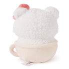 Back view of a plush Hello Kitty in a teacup.