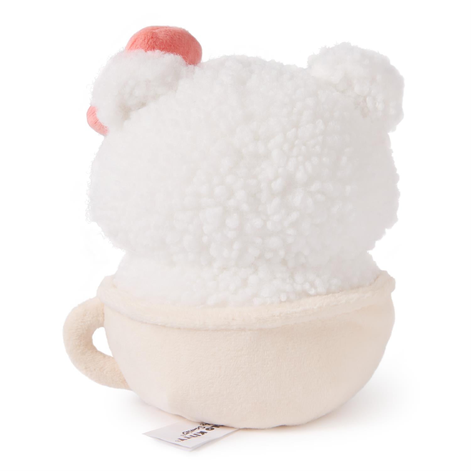 Back view of a plush Hello Kitty in a teacup.