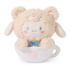 Stuffed teddy bear with sheep's wool fur in a white teacup with light-pink details.