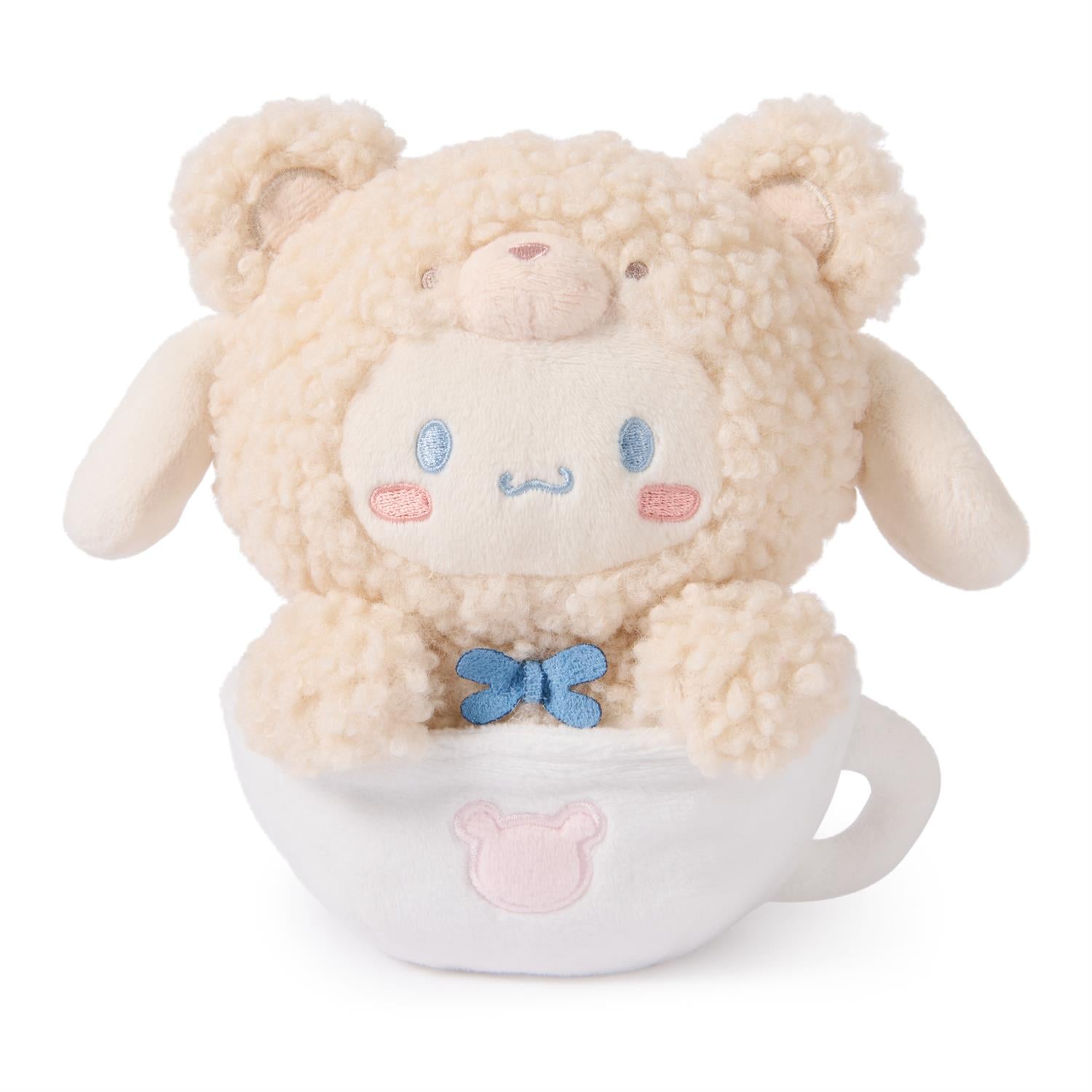 Stuffed teddy bear with sheep's wool fur in a white teacup with light-pink details.