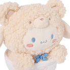 Cream-colored, plush, stuffed animal with a light blue bow tie.