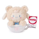 Stuffed bear in a teacup with a Gund tag.