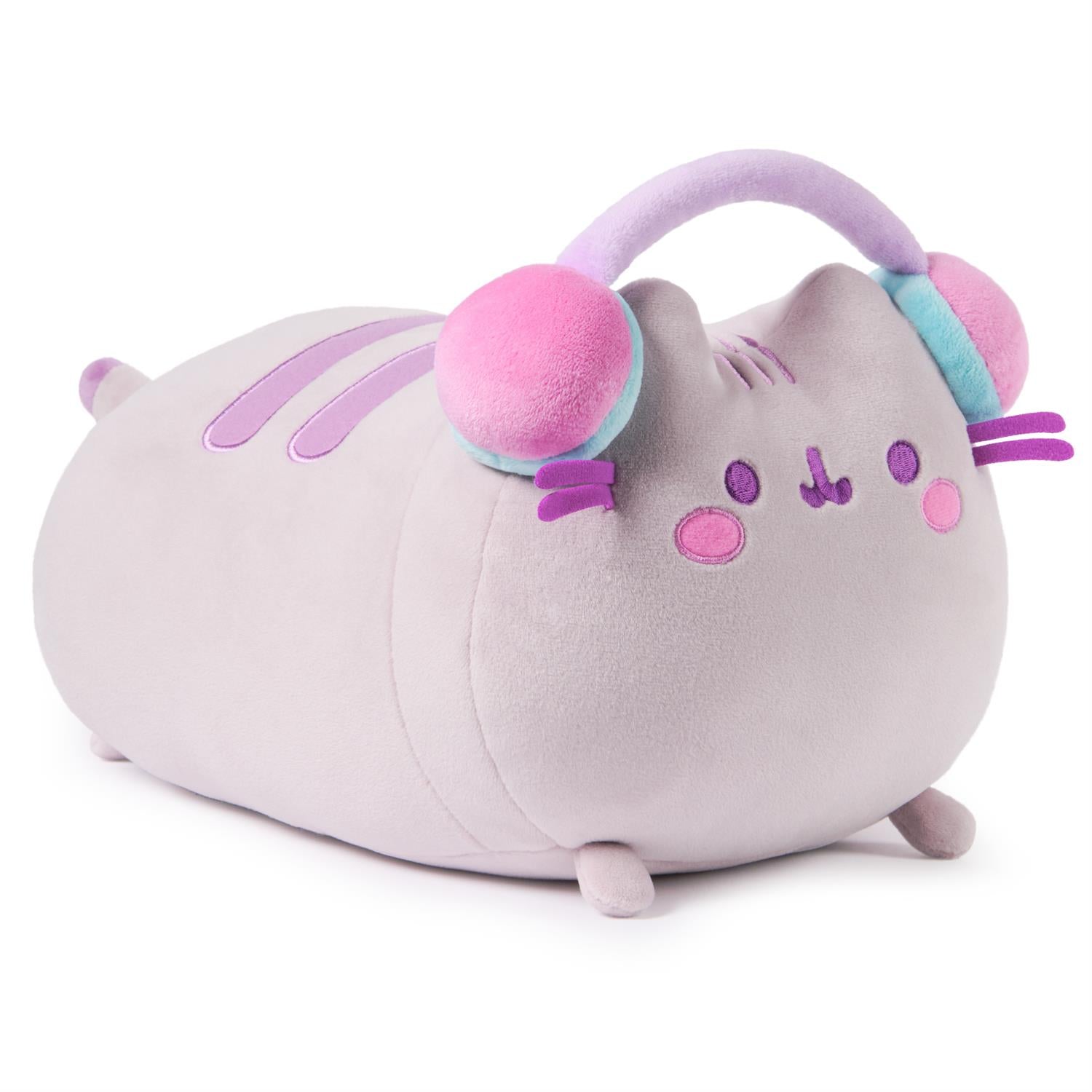 Lilac plush Pusheen cat wearing headphones.