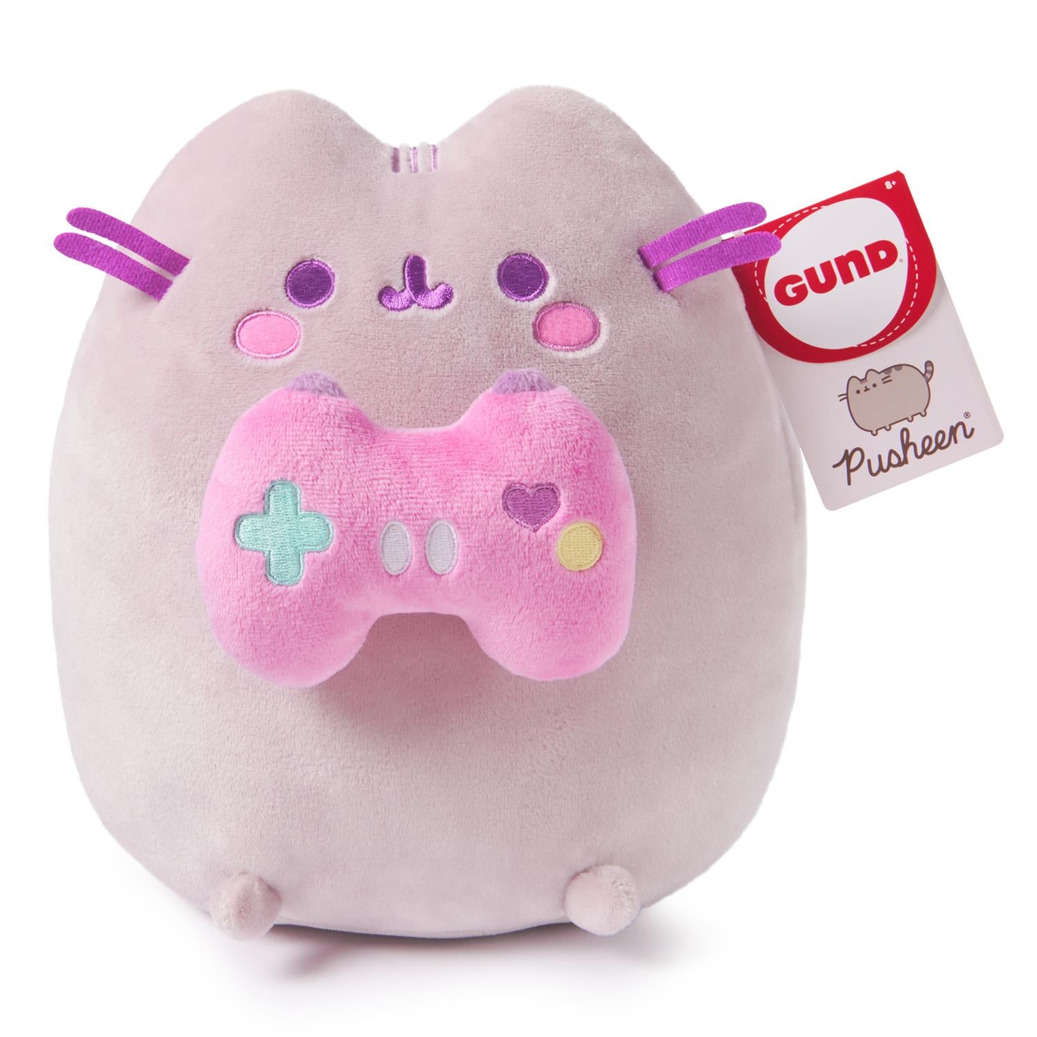 Pusheen plush toy holding a pink game controller.