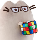 Plush tan cat toy wearing glasses and holding a Rubik's Cube.