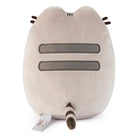 Back view of a Pusheen plush toy.