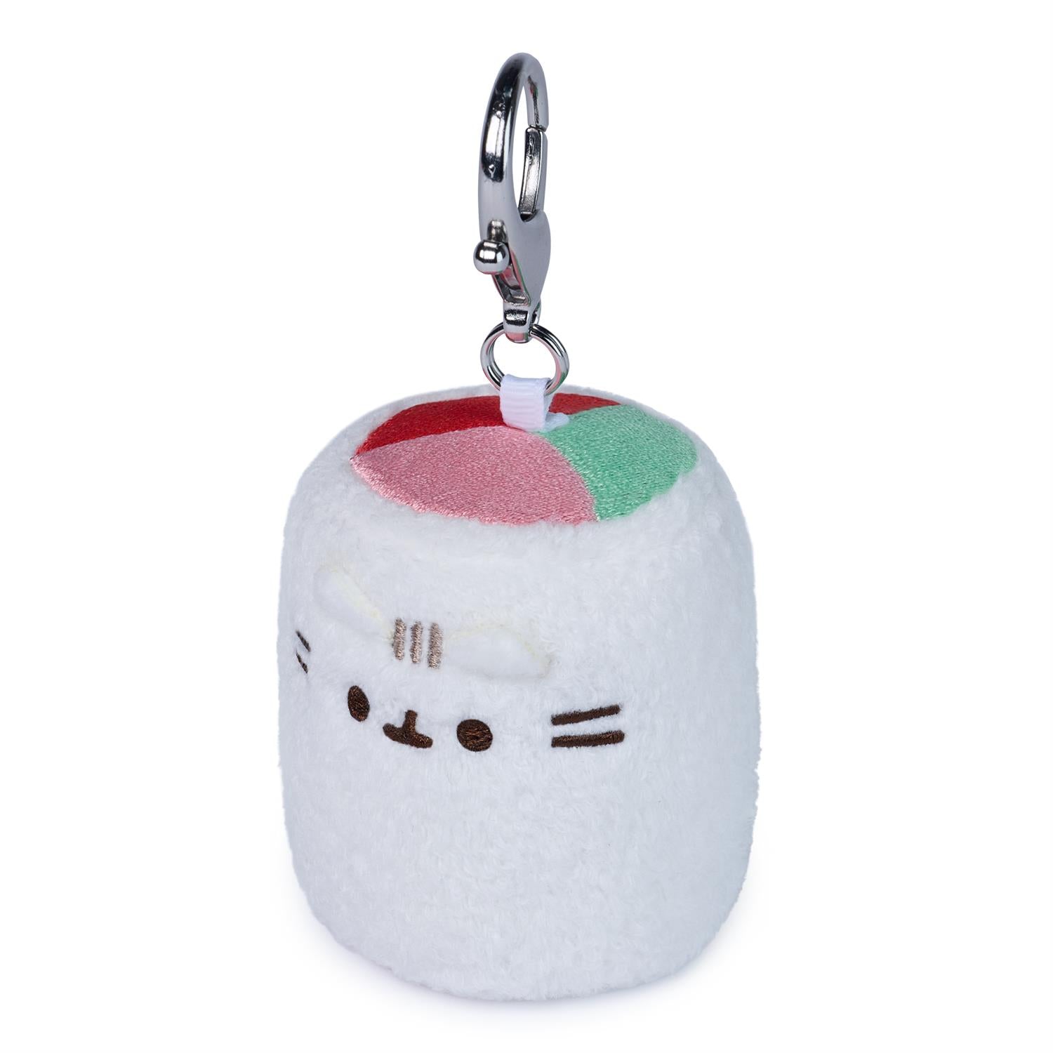 Plush keychain shaped like a cat with a cherry on top on a white background