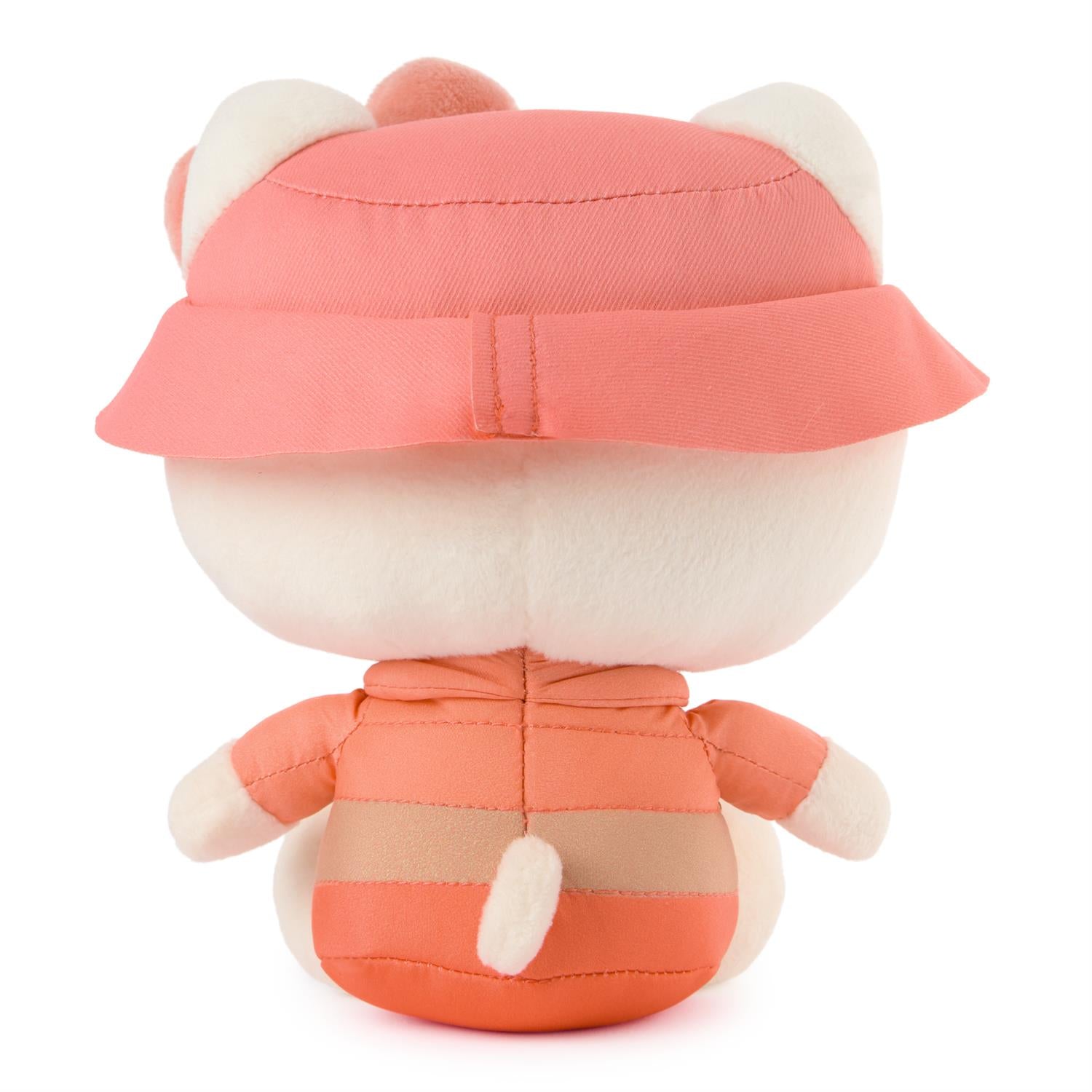Plush toy with a pink hat and matching outfit on a white background