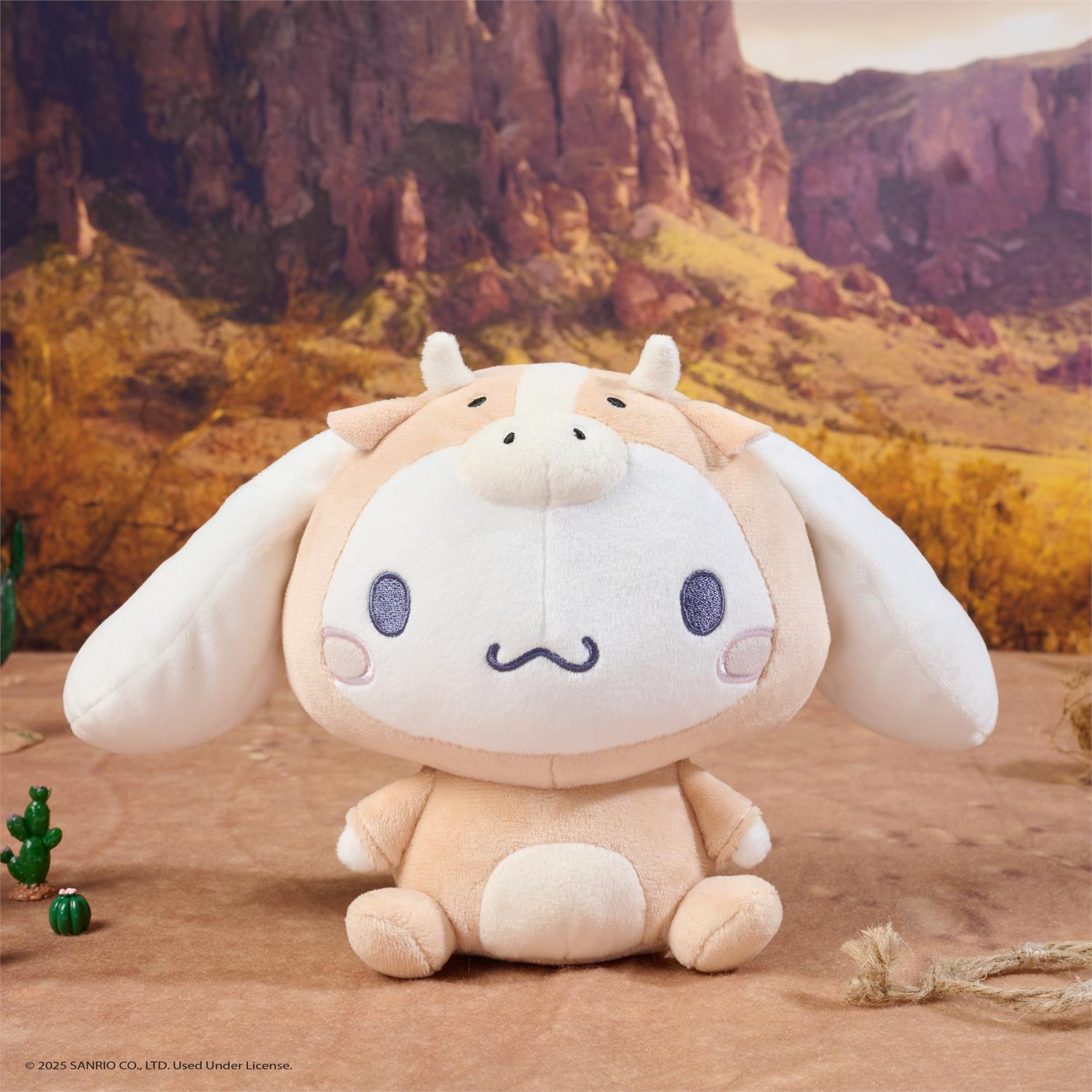 Plush toy with a desert landscape background