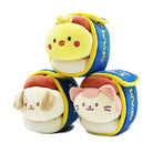 Three plush toys stacked on top of each other. They are shaped like spam cans, with the word "SPAM" written on the blue can. The top one is a yellow chick, the middle one is a beige dog, and the bottom one is a pink and white cat.