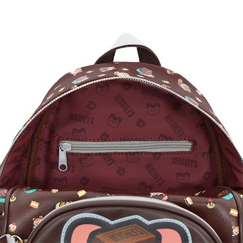 Open brown backpack with Hershey's patterns.
