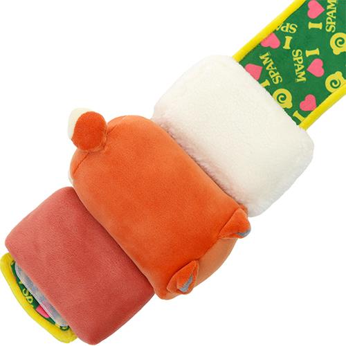 A stuffed toy sandwich with Spam and a Spam-themed green strap.