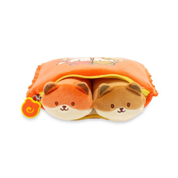 Orange and tan plush slippers in a zippered orange plush pouch.