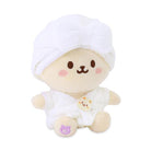Stuffed animal wearing towel turban and robe.