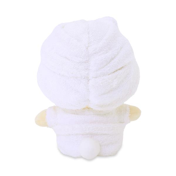Rear view of a white plush duck toy wrapped in a white towel.