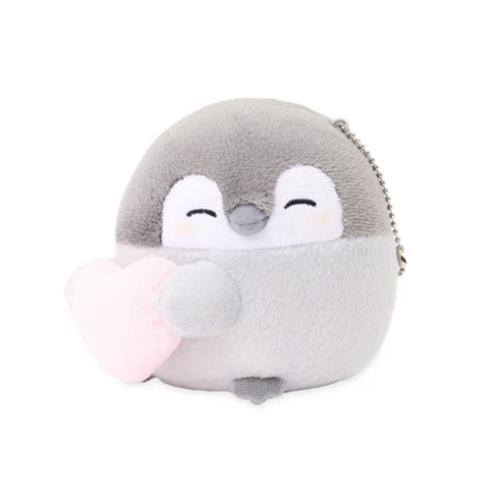 A gray and white plush penguin holding a pink heart.