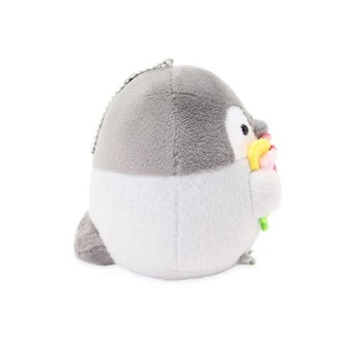 Gray and white plush penguin holding a flower.