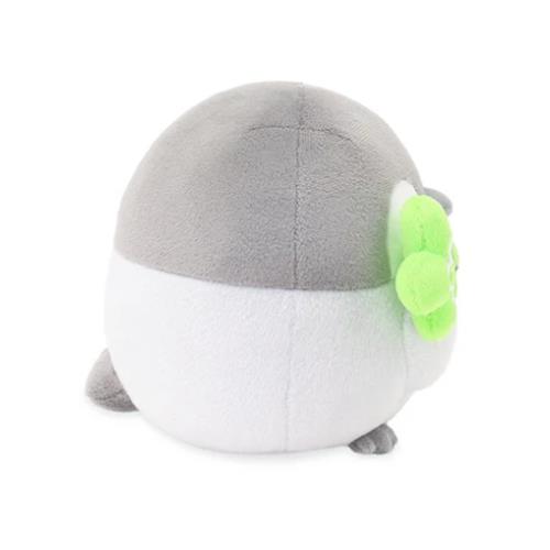 Round gray and white plush toy with green detail.