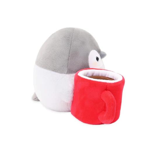 Stuffed penguin with red mug.
