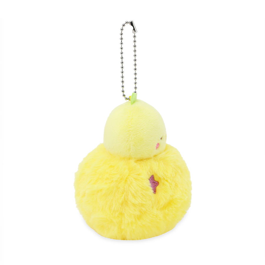 Yellow plush keychain with a small pink heart on a white background