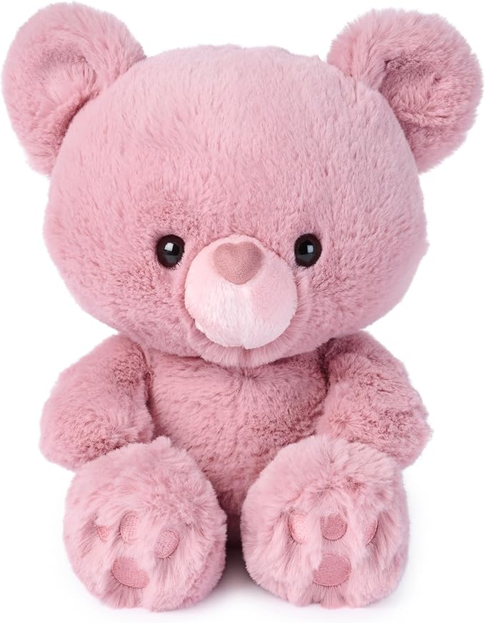 Pink teddy bear on a white background