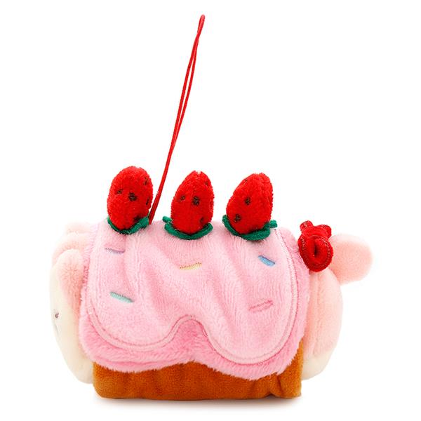 Plush toy cake with strawberry topping.