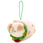 Plush dog toy wrapped in a pink burrito with green lettuce and a red tomato, hanging from a green string.