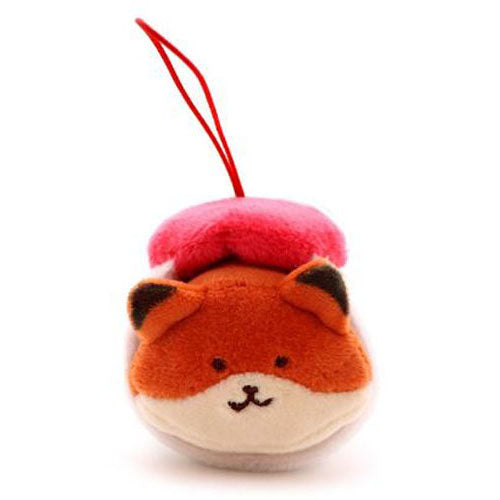 Plush toy fox with red strap.