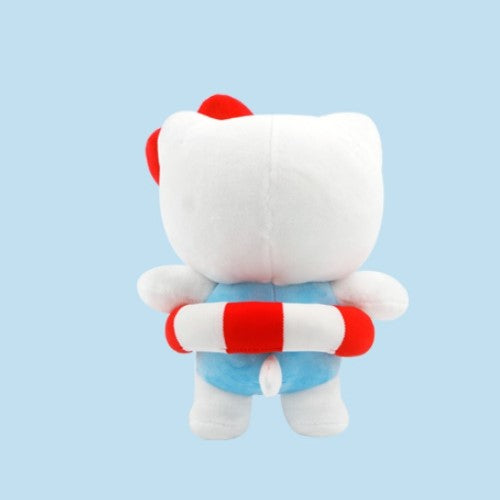 Back view of a Hello Kitty plush toy in a blue swimsuit and a red and white life preserver, against a light blue background.