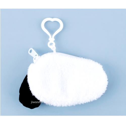 White and black plush panda coin purse with a heart-shaped plastic clip on a blue background.