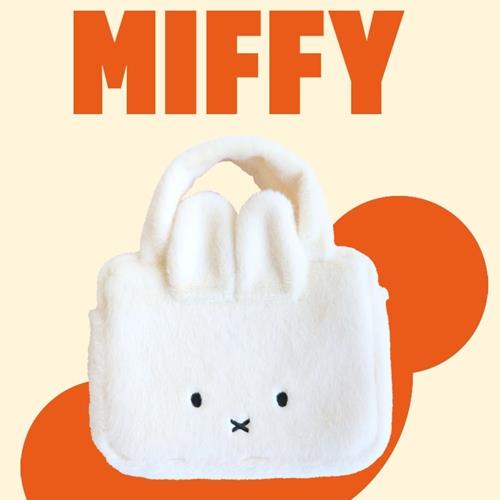 White plush Miffy bag with orange text and accents.