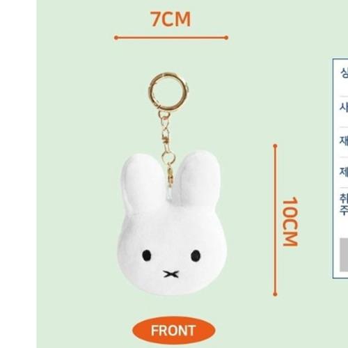 White bunny keychain, black eyes and mouth, gold key ring.