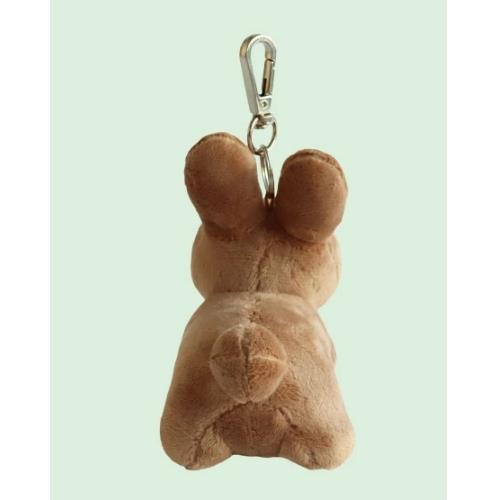 Rear view of a tan plush bunny keychain.