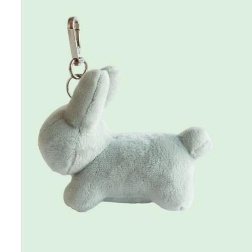 Side view of a light blue plush bunny keychain with a silver clip.