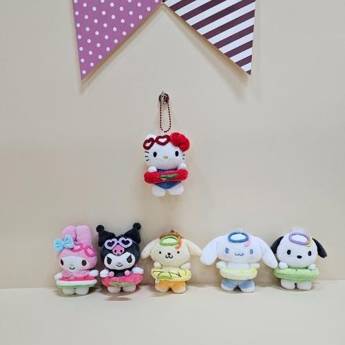 A group of stuffed Sanrio characters with beach-themed outfits.